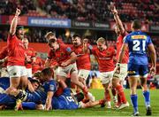 2 October 2021; Munster players celebrate after Jack O'Donoghue of Munster, hidden, goes over to score their fourth try during the United Rugby Championship match between Munster and DHL Stormers at Thomond Park in Limerick. Photo by Sam Barnes/Sportsfile
