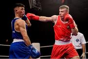 2 October 2021; Kieran Molloy of Oughterard Boxing Club, Galway, right, and Luke Maguire of Esker Boxing Club, Dublin, during their 71kg bout at the IABA National Elite Boxing Championships Finals in the National Stadium in Dublin. Photo by Seb Daly/Sportsfile