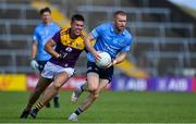 4 July 2021; Aaron Byrne of Dublin in action against Eoin Porter of Wexford during the Leinster GAA Football Senior Championship Quarter-Final match between Wexford and Dublin at Chadwicks Wexford Park in Wexford. Photo by Brendan Moran/Sportsfile