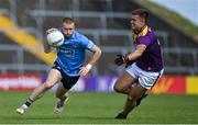 4 July 2021; Aaron Byrne of Dublin in action against Eoin Porter of Wexford during the Leinster GAA Football Senior Championship Quarter-Final match between Wexford and Dublin at Chadwicks Wexford Park in Wexford. Photo by Brendan Moran/Sportsfile