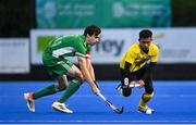 5 October 2021; Ashra Hamsani of Malaysia in action against Sean Murray of Ireland during an international friendly match between Ireland and Malaysia at Lisnagarvey Hockey Club in Hillsborough, Down. Photo by Ramsey Cardy/Sportsfile