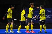 5 October 2021; Abu Kamal Azrai of Malaysia, second from right, celebrates with team-mates after scoring his side's first goal during an international friendly match between Ireland and Malaysia at Lisnagarvey Hockey Club in Hillsborough, Down. Photo by Ramsey Cardy/Sportsfile