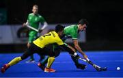 5 October 2021; Mark McNellis of Ireland in action against Najib Hassan of Malaysia during an international friendly match between Ireland and Malaysia at Lisnagarvey Hockey Club in Hillsborough, Down. Photo by Ramsey Cardy/Sportsfile