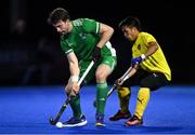 5 October 2021; Jeremy Duncan of Ireland in action against Faiz Jali of Malaysia during an international friendly match between Ireland and Malaysia at Lisnagarvey Hockey Club in Hillsborough, Down. Photo by Ramsey Cardy/Sportsfile