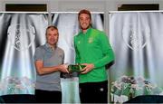 6 October 2021; Goalkeeper Mark Travers is presented with his 2020-2021 Republic of Ireland international cap by former Republic of Ireland player Denis Irwin during a presentation at their team hotel in Dublin. Photo by Stephen McCarthy/Sportsfile