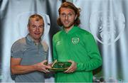 6 October 2021; Jeff Hendrick is presented with his 2020-2021 Republic of Ireland international cap by former Republic of Ireland player Denis Irwin during a presentation at their team hotel in Dublin. Photo by Stephen McCarthy/Sportsfile