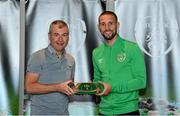 6 October 2021; Conor Hourihane is presented with his 2020-2021 Republic of Ireland international cap by former Republic of Ireland player Denis Irwin during a presentation at their team hotel in Dublin. Photo by Stephen McCarthy/Sportsfile