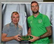 6 October 2021; Shane Duffy is presented with his 2020-2021 Republic of Ireland international cap by former Republic of Ireland player Denis Irwin during a presentation at their team hotel in Dublin. Photo by Stephen McCarthy/Sportsfile