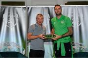 6 October 2021; Shane Duffy is presented with his 2020-2021 Republic of Ireland international cap by former Republic of Ireland player Denis Irwin during a presentation at their team hotel in Dublin. Photo by Stephen McCarthy/Sportsfile