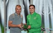 6 October 2021; Josh Cullen is presented with his 2020-2021 Republic of Ireland international cap by former Republic of Ireland player Denis Irwin during a presentation at their team hotel in Dublin. Photo by Stephen McCarthy/Sportsfile