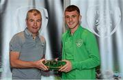 6 October 2021; Jason Knight is presented with his 2020-2021 Republic of Ireland international cap by former Republic of Ireland player Denis Irwin during a presentation at their team hotel in Dublin. Photo by Stephen McCarthy/Sportsfile