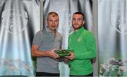 6 October 2021; Aaron Connolly is presented with his 2020-2021 Republic of Ireland international cap by former Republic of Ireland player Denis Irwin during a presentation at their team hotel in Dublin. Photo by Stephen McCarthy/Sportsfile