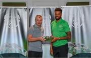 6 October 2021; Cyrus Christie is presented with his 2020-2021 Republic of Ireland international cap by former Republic of Ireland player Denis Irwin during a presentation at their team hotel in Dublin. Photo by Stephen McCarthy/Sportsfile