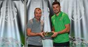 6 October 2021; John Egan is presented with his 2020-2021 Republic of Ireland international cap by former Republic of Ireland player Denis Irwin during a presentation at their team hotel in Dublin. Photo by Stephen McCarthy/Sportsfile