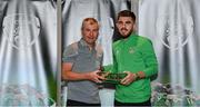 6 October 2021; Ryan Manning is presented with his 2020-2021 Republic of Ireland international cap by former Republic of Ireland player Denis Irwin during a presentation at their team hotel in Dublin. Photo by Stephen McCarthy/Sportsfile