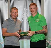 6 October 2021; James McClean is presented with his 2020-2021 Republic of Ireland international cap by former Republic of Ireland player Denis Irwin during a presentation at their team hotel in Dublin. Photo by Stephen McCarthy/Sportsfile
