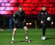7 October 2021; James McClean and Andrew Morrissey, StatSports technician, right, during a Republic of Ireland training session at the Baku Olympic Stadium Training Pitch in Baku, Azerbaijan. Photo by Stephen McCarthy/Sportsfile