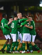 7 October 2021; Justin Ferizaj of Republic of Ireland, hidden, celebrates with team-mates after scoring their side's first goal during the UEFA U17 Championship Qualifier match between Republic of Ireland and Andorra at Turner's Cross in Cork. Photo by Eóin Noonan/Sportsfile