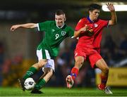 7 October 2021; Mark O'Mahony of Republic of Ireland in action against Guillem Acosta Farre of Andorra during the UEFA U17 Championship Qualifier match between Republic of Ireland and Andorra at Turner's Cross in Cork. Photo by Eóin Noonan/Sportsfile