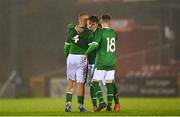 7 October 2021; Republic of Ireland players, from left, Sam Curtis, Kevin Zefi and Alex Nolan of Republic of Ireland celebrate after their side's victory in the UEFA U17 Championship Qualifier match between Republic of Ireland and Andorra at Turner's Cross in Cork. Photo by Eóin Noonan/Sportsfile