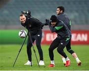 8 October 2021; Callum Robinson, Troy Parrott, right, and videographer Matty Turnbull are targets of a kicked ball as they record footage during a Republic of Ireland training session at the Olympic Stadium in Baku, Azerbaijan. Photo by Stephen McCarthy/Sportsfile