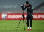 8 October 2021; Callum Robinson records footage during a Republic of Ireland training session at the Olympic Stadium in Baku, Azerbaijan. Photo by Stephen McCarthy/Sportsfile