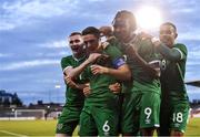 8 October 2021; Conor Coventry of Republic of Ireland, second from left, celebrates with team-mates, from left, Ross Tierney, Joshua Ogunfaolu-Kayode and Tyreik Wright, after scoring his side's second goal, a penalty, during the UEFA European U21 Championship Qualifier match between Republic of Ireland and Luxembourg at Tallaght Stadium in Dublin.  Photo by Sam Barnes/Sportsfile