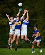 9 October 2021; Darragh Warnock of Castleknock in action against Eoin Adamson, left, and Mark L'estrange of St Vincent's during the Go Ahead Dublin County Senior Club Football Championship Group 2 match between Castleknock and St Vincent's at Naul in Dublin. Photo by David Fitzgerald/Sportsfile