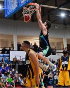 9 October 2021; Eoin Quigley of Garvey's Tralee Warriors dunks over Simon Francis of Team 360 Financial Killorglin during the InsureMyVan.ie Men's SuperLeague South Conference match between Garveys Tralee Warriors and Team 360 Financial Killorglin at Tralee Sports Complex in Tralee, Kerry. Photo by Brendan Moran/Sportsfile