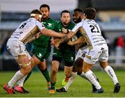 9 October 2021; Jack Carty of Connacht is tackled by Aaron Wainwright, left, and Gonzalo Bertranou of Dragons during the United Rugby Championship match between Connacht and Dragons at The Sportsground in Galway. Photo by Seb Daly/Sportsfile