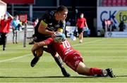 10 October 2021; Calvin Nash of Munster is tackled by Sam Costelow of Scarlets during the United Rugby Championship match between Scarlets and Munster at Parc Y Scarlets in Llanelli, Wales. Photo by Gareth Everett/Sportsfile