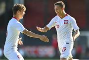 10 October 2021; Maksymilian Dziuba of Poland, right, celebrates with team-mate Tomasso Guercio after scoring their side's first goal during the UEFA U17 Championship Qualifying Round Group 5 match between Poland and Andorra at The Mardyke in Cork. Photo by Eóin Noonan/Sportsfile