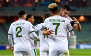 9 October 2021; Callum Robinson is congratulated by his Republic of Ireland team-mate John Egan, right, after scoring their opening goal during the FIFA World Cup 2022 qualifying group A match between Azerbaijan and Republic of Ireland at the Olympic Stadium in Baku, Azerbaijan. Photo by Stephen McCarthy/Sportsfile
