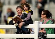 10 October 2021; Oisin Leavy, aged three, with his toy horse watches the Bord Na Mona Recycling Apprentice Handicap at The Curragh Racecourse in Kildare. Photo by Harry Murphy/Sportsfile