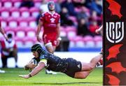 10 October 2021; Chris Cloete of Munster dives over to score his side's sixth try during the United Rugby Championship match between Scarlets and Munster at Parc Y Scarlets in Llanelli, Wales. Photo by Ben Evans/Sportsfile