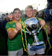 10 October 2021; Sean Elliott, left, and Eoin O'Neill of Dunloy with the trophy following the Antrim County Senior Club Hurling Championship Final match between Dunloy and O'Donovan Rossa at Corrigan Park in Belfast. Photo by Ramsey Cardy/Sportsfile