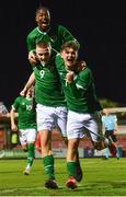 10 October 2021; Mark O'Mahony of Republic of Ireland celebrates with team-mates Franco Umeh, left, and Kevin Zefi after scoring his side's second goal during the UEFA U17 Championship Qualifying Round Group 5 match between Republic of Ireland and North Macedonia at Turner's Cross in Cork. Photo by Eóin Noonan/Sportsfile