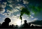 10 October 2021; A Dunloy supporter holds a flare after the Antrim County Senior Club Hurling Championship Final match between Dunloy and O'Donovan Rossa at Corrigan Park in Belfast. Photo by Ramsey Cardy/Sportsfile