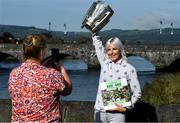 11 October 2021; Maria Croke O'Sullivan holds the Liam MacCarthy cup as she is photographed by her Limerick City and County Council colleague Yvonne Daly at the launch of 'Back 2 Back' at Limerick City and County Council offices at Merchants Quay in Limerick. Photo by Ray McManus/Sportsfile