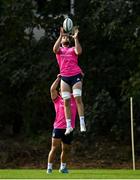 11 October 2021; Caelan Doris is lifted by Rónan Kelleher during a Leinster Rugby squad training session at UCD in Dublin. Photo by Harry Murphy/Sportsfile