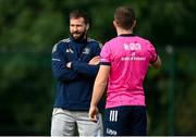 11 October 2021; Elite player development officer Kieran Hallett speaks with Luke McGrath during a Leinster Rugby squad training session at UCD in Dublin. Photo by Harry Murphy/Sportsfile