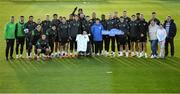 11 October 2021; Republic of Ireland manager Stephen Kenny and players pose for a photograph with Liam Mooney and his family, from Malin Head, Donegal, during a Republic of Ireland training session at the FAI National Training Centre in Abbotstown, Dublin. Liam got the opportunity to meet the Republic of Ireland team after the Make-A-Wish granted his wish to meet the Republic of Ireland team. Make-A-Wish is a Children's Charity which grants the wishes of children with life-threatening medical conditions to give hope, strength and joy. Photo by Stephen McCarthy/Sportsfile