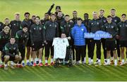 11 October 2021; Republic of Ireland players pose for a photograph with Liam Mooney and his family, from Malin Head, Donegal, during a Republic of Ireland training session at the FAI National Training Centre in Abbotstown, Dublin. Liam got the opportunity to meet the Republic of Ireland team after the Make-A-Wish granted his wish to meet the Republic of Ireland team. Make-A-Wish is a Children's Charity which grants the wishes of children with life-threatening medical conditions to give hope, strength and joy. Photo by Stephen McCarthy/Sportsfile