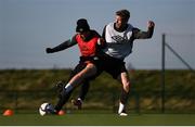 11 October 2021; Aaron Connolly, left, is tackled by Nathan Collins during a Republic of Ireland training session at the FAI National Training Centre in Abbotstown, Dublin. Photo by Stephen McCarthy/Sportsfile
