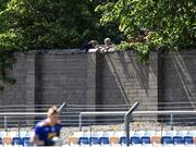 27 June 2021; Spectators look over a wall, from outside the ground, during the Leinster GAA Football Senior Championship Round 1 match between Wicklow and Wexford at County Grounds in Aughrim, Wicklow. Photo by Piaras Ó Mídheach/Sportsfile