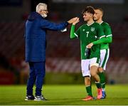 10 October 2021; Kevin Zefi of Republic of Ireland with FAI high performace director Ruud Dokter after the UEFA U17 Championship Qualifying Round Group 5 match between Republic of Ireland and North Macedonia at Turner's Cross in Cork. Photo by Eóin Noonan/Sportsfile