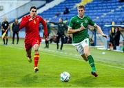 12 October 2021; Mark McGuinness of Republic of Ireland in action against Nikola Janjic of Montenegro during the UEFA European U21 Championship Qualifier Group F match between Montenegro and Republic of Ireland at Gradski Stadion Podgorica in Podgorica, Montenegro. Photo by Filip Roganovic/Sportsfile