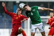 12 October 2021; Conor Coventry of Republic of Ireland in action against Danilo Pesukic of Montenegro during the UEFA European U21 Championship Qualifier Group F match between Montenegro and Republic of Ireland at Gradski Stadion Podgorica in Podgorica, Montenegro. Photo by Filip Roganovice/Sportsfile