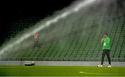 12 October 2021; Cyrus Christie of Republic of Ireland walks the pitch as it is watered before the international friendly match between Republic of Ireland and Qatar at Aviva Stadium in Dublin. Photo by Eóin Noonan/Sportsfile