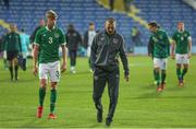 12 October 2021; Republic of Ireland manager Jim Crawford, right, and Joel Bagan of Republic of Ireland after their defeat in the UEFA European U21 Championship Qualifier Group F match between Montenegro and Republic of Ireland at Gradski Stadion Podgorica in Podgorica, Montenegro. Photo by Filip Roganovic/Sportsfile